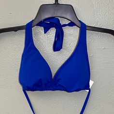 Blue Bikini Top Nwt And In Perfect Condition. Solid Blue Swimsuit Top With Removable Pads. Halter Design Ties Around Neck And Around Back. Bottom Of Triangle Bralette Is Adjustable / Moveable And Can Be Spread Out More Or Scrunched Together. Blue Bra Friendly Halter Top For Sunbathing, Blue Summer Halter Top Bra Friendly, Blue Triangle Halter Top For Beach Party, Blue Beachwear Halter Top For Beach, Blue Beachwear Halter Top For Vacation, Blue Triangle Halter Top For Summer, Blue Halter Top For Beach Vacation, Blue Halter Top For Beach, Fitted Triangle Halter Top For Pool