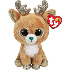 a small stuffed animal with big eyes and gold antlers on it's head