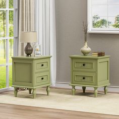 two green nightstands sitting next to each other on top of a rug