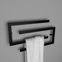 a towel rack with two towels hanging from it's sides and one folded up