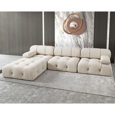 a large sectional sofa with tufted cushions in a modern living room setting, designed for comfort and relaxation