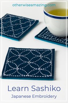 three coasters with the words learn sashiko on them and a cup of tea