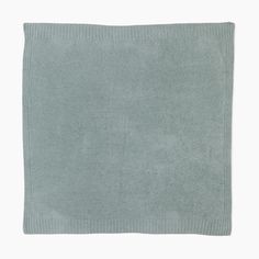 a light blue rug is shown on a white background and it has a square shape