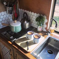 the kitchen sink is clean and ready to be used as a coffee maker or tea kettle