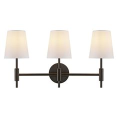 three light bathroom fixture with white shades on the lamps and shade shades on the wall