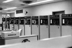 a row of machines sitting inside of a room