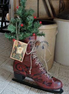 a pair of red boots sitting on top of a rug next to a christmas tree