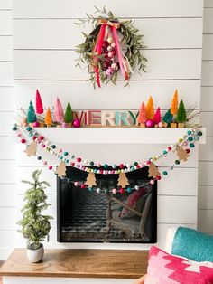 a fireplace decorated with christmas decorations and garland