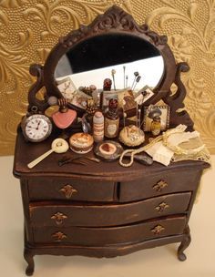 there is a dresser with many items on it