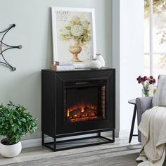 a living room with a fire place in the corner and a chair next to it