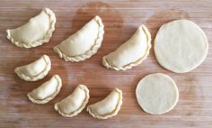 several different types of pastries on a cutting board