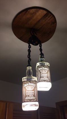 two mason jar chandeliers hanging from the ceiling