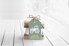 a bag filled with cookies sitting on top of a wooden table next to a tag