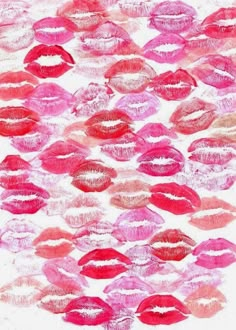 lipstick kisses drawn on paper with pink and red colors in the shape of an abstract pattern