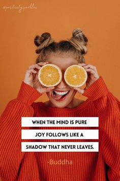 a woman holding two oranges up to her eyes with the caption, when the mind is pure joy follows like a shadow that never leaves