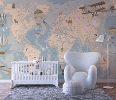 a baby's room with a world map wallpaper