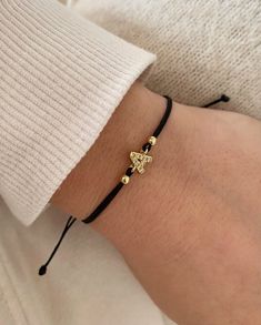 This a dainty and minimal letter bracelet. D E T A I L S Tiny 18k gold plated Initial Charm ~ 7mm ~ with clear cubic zirconia. Adjustable cotton cord with macrame closing . Available colours: Black, Dark red, Mocca , Dark Blue, White Elegant Personalized Gold Friendship Bracelets, Elegant Yellow Gold Friendship Bracelets As Gift, Adjustable Gold Name Bracelet As Gift For Her, Initial Bracelet Couples, Bracelets With Initials, Bracelets For Bridesmaids, Bracelet With Initials, Letters Bracelet, Gold Bracelets Stacked