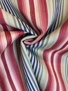 a multicolored striped fabric is shown