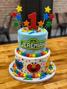 a sesame street birthday cake on a table