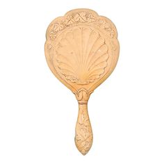 a wooden spoon with an ornate design on it