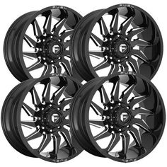 four black wheels on white background