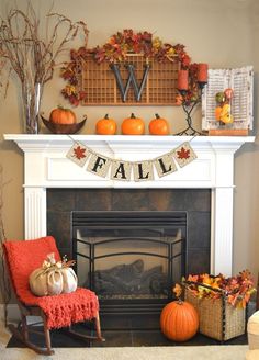 a fireplace decorated with fall decorations and pumpkins