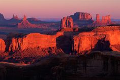 the sun is setting over canyons and mountains