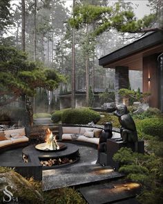 an outdoor fire pit surrounded by trees and bushes with statues in the center on either side