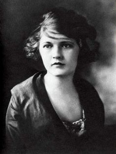 an old black and white photo of a woman