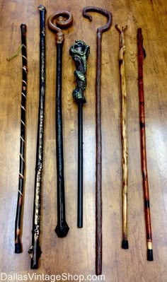 several different types of canes on a wooden table