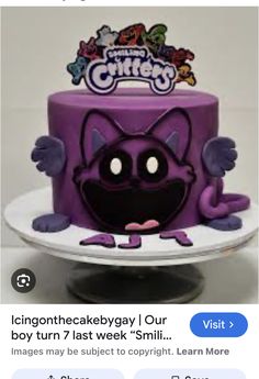 a purple cake with an image of a cartoon character on the top and bottom layer