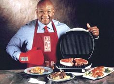 a man in an apron holding up a grill