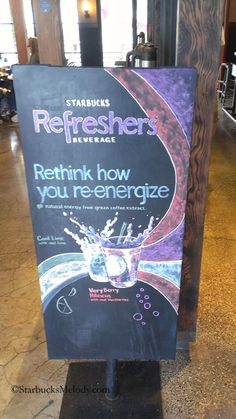 a sign advertising refreshers on the floor