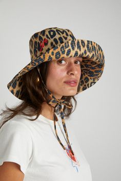 Our Damson Madder sun hat is a classic bucket hat shape with wide brim. It features a tie neck and and leopard print design with contrasting red DM embroidery. •One size - 57cm circumference •Made from 100% organic cotton •Features classic DM Leopard print •Made in India Damson Madder, Flower Scrunchie, Mad Hat, Reversible Tote Bag, Canvas Makeup Bag, Soft Hats, Scarf Yarn, Quilted Backpack, Skirt Co Ord