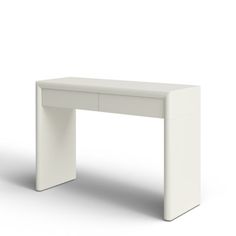 a white desk sitting on top of a white floor