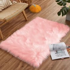 PRICES MAY VARY. 【Premium Material】Size: 24 in. x 36 in. (60cm x 90cm). Made of 100% high-quality faux sheepskin fur, which is skin-friendly and non-toxic, our rug ensures long-term comfort and safety for your living space. 【Cozy Luxury】Boasting 2.36 inches of high-quality long fibers, our rug offers a cloud-like softness, relieving fatigue effortlessly. It's not just a retreat for you but also an inviting haven for your furry friends, guaranteeing a cozy experience for both. 【Flame Resistant & Small Pink Rug, Cute Rug, Fuzzy Rug, Cozy Luxury, Faux Fur Rug, Fur Rug, 4x6 Area Rugs, Rug For Bedroom, 6x9 Area Rugs