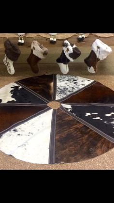 several different types of cow hides are arranged in a circle on top of a skateboard