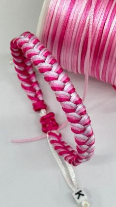 two spools of pink thread next to each other