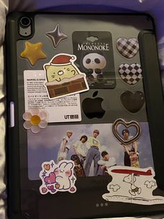 an ipad case with stickers on it