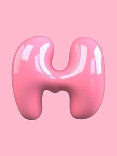 the letter u is made up of shiny pink material and stands in front of a light pink background