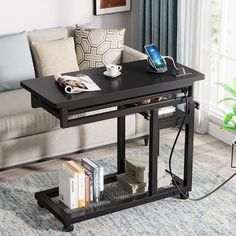 a living room with a couch, coffee table and bookshelf on the floor