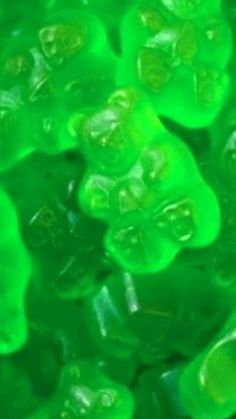 green gummy bears sitting on top of each other