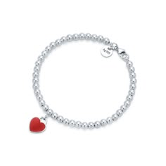 Inspired by the iconic key ring first introduced in 1969, the Return to Tiffany collection is a classic reinvented. An elegant bead bracelet and engraved tag combine to create a simple and timeless design. Sterling silver; Size extra small; Fits wrists up to 5.25"; Beads, 4 mm | Return To Tiffany® Red Heart Tag Bead Bracelet in Silver, Size: Extra Small Tiffany Bead Bracelet, Elastic Heart, Tiffany Bracelets, Return To Tiffany, Boho Crystal, Designer Bracelets, Crystal Fashion, Silver Bracelets For Women, Tiffany Jewelry