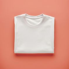 Mockup of White Folded T shirt on Plain Peach Background Digital File Download. Plain Peach Background, Plain White T Shirt, Peach Background, T Shirt Mockup, Tshirt Mockup, Shirt Mockup, White Tshirt, Printed Items, Digital Files