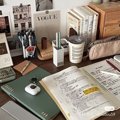 an open book sitting on top of a wooden desk