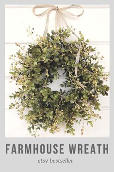 a wreath hanging on the side of a door with an ad for farm house wreath