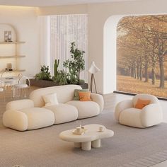 a living room filled with white furniture next to a large open window covered in trees