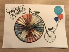 a birthday card with a bicycle and balloons