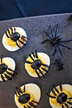 halloween cupcakes with spider decorations on them