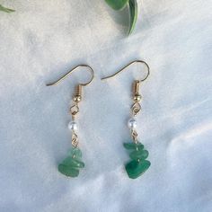 Handmade with care, these elegant boho-chic crystal earrings feature agate accented with gold toned findings and a faux pearl for a timeless look. The soft green blue hues of the agate stones and the classic pearl detail make these earrings versatile enough for both casual wear and special occasions. Lightweight and comfortable, they bring a touch of sophistication and a hint of natural beauty to any outfit. Care Instructions: -Keep dry to preserve the metal finish - Store in a jewelry box or pouch  - Wipe gently with a soft cloth to clean  If you have any questions or requests please feel free to message me :) May Gemini, Gemini Birthstone, Jewelry Delicate, Diy Jewelry Ideas, Syracuse Ny, Crystal Dangle Earrings, Pearl Crystal, Birthstone Gifts, Agate Crystal